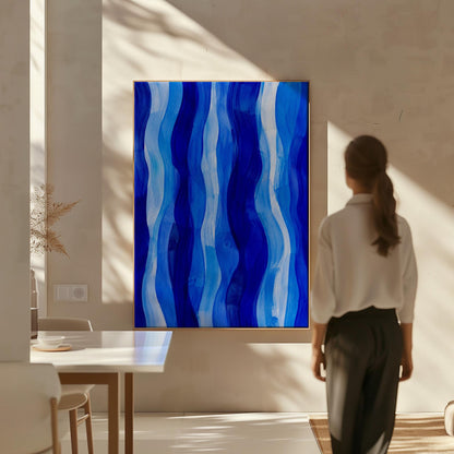 Vertical flowing ribbons in cobalt and light blue, canvas print shown to scale in a furnished room