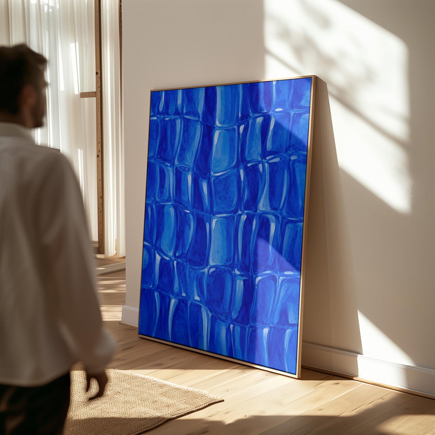 Mosaic of rounded royal blue shapes like cobblestones, canvas print styled against a soft white wall