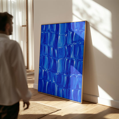 Mosaic of rounded royal blue shapes like cobblestones, canvas print styled against a soft white wall