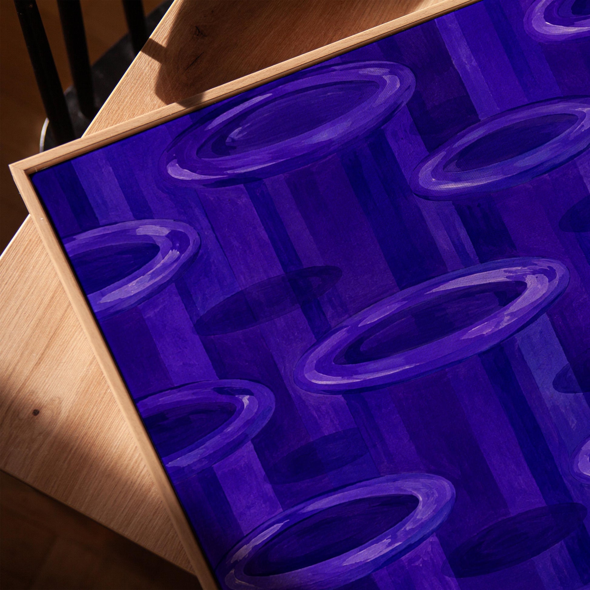 Rings emerging from deep violet and amethyst tones, canvas print in a warm, minimally styled interior