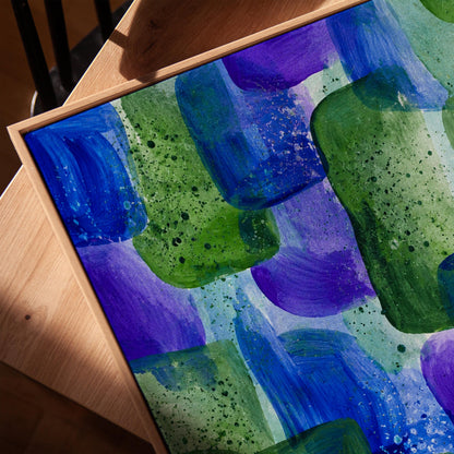 Painterly blocks in saturated blue purple and green, canvas print in a warm, minimally styled interior