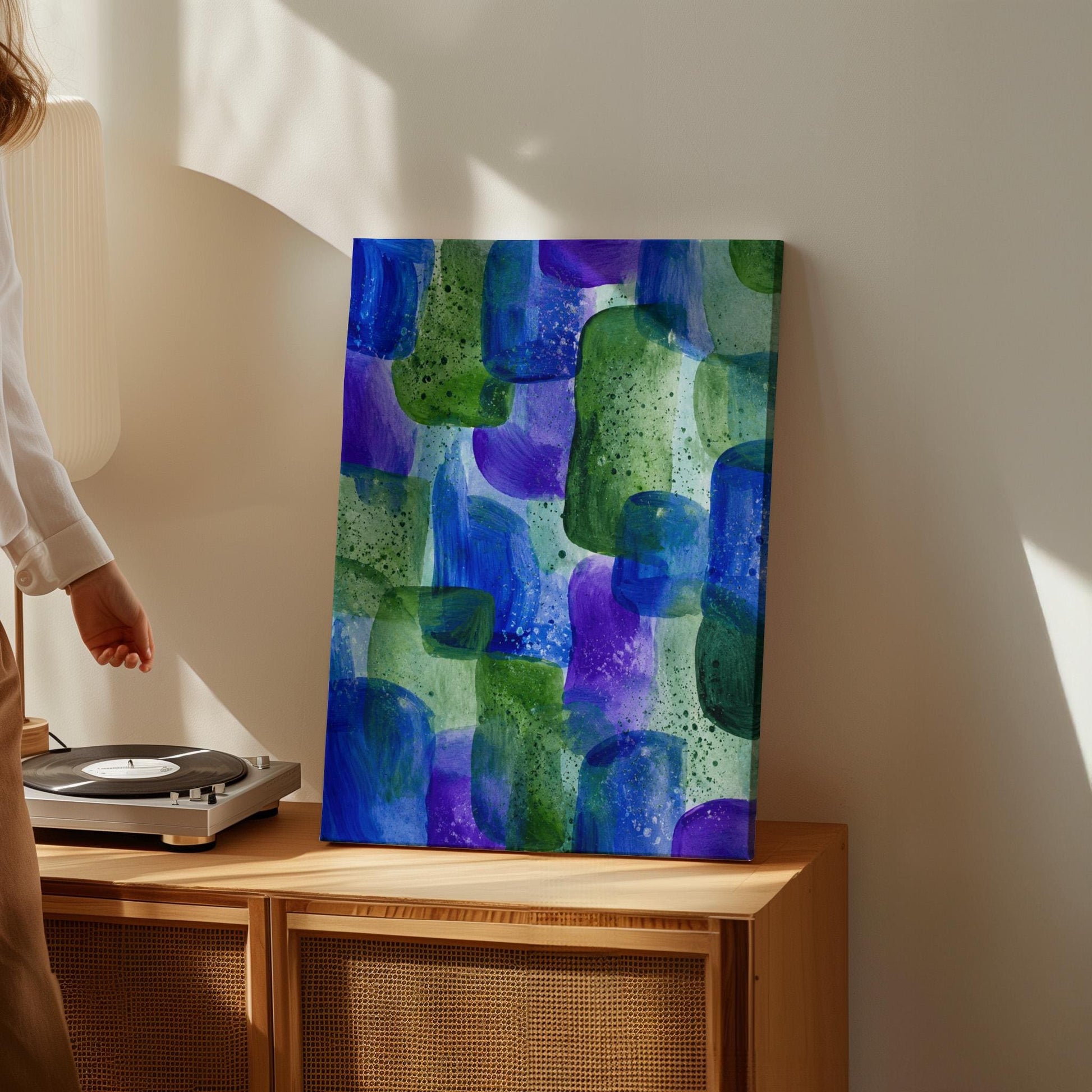 Painterly blocks in saturated blue purple and green, canvas print styled against a soft white wall