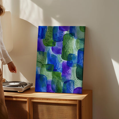 Painterly blocks in saturated blue purple and green, canvas print styled against a soft white wall