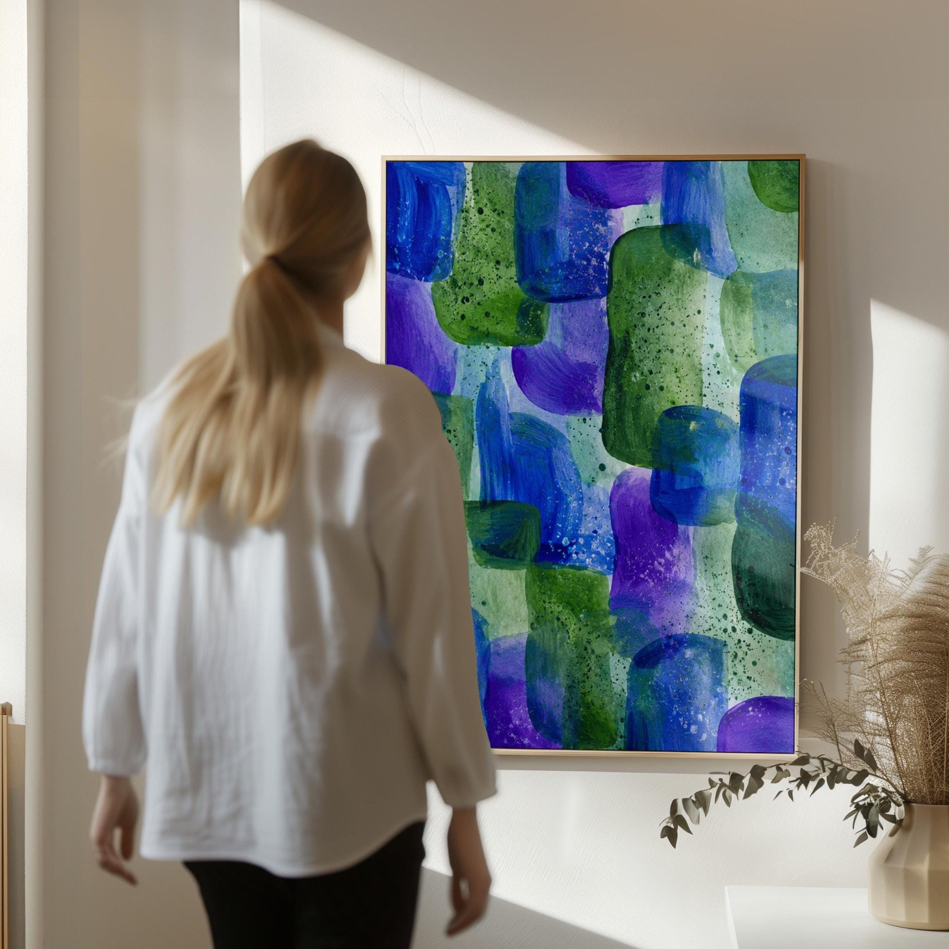 Painterly blocks in saturated blue purple and green, canvas print shown to scale in a furnished room