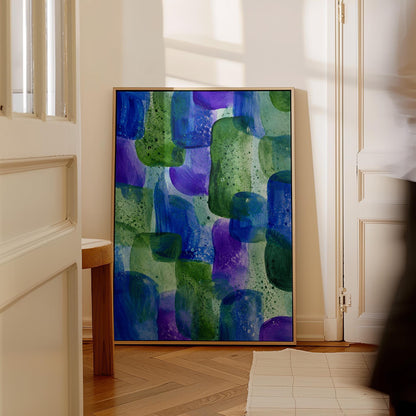 Painterly blocks in saturated blue purple and green, canvas wall art on a quiet wall in a considered interior
