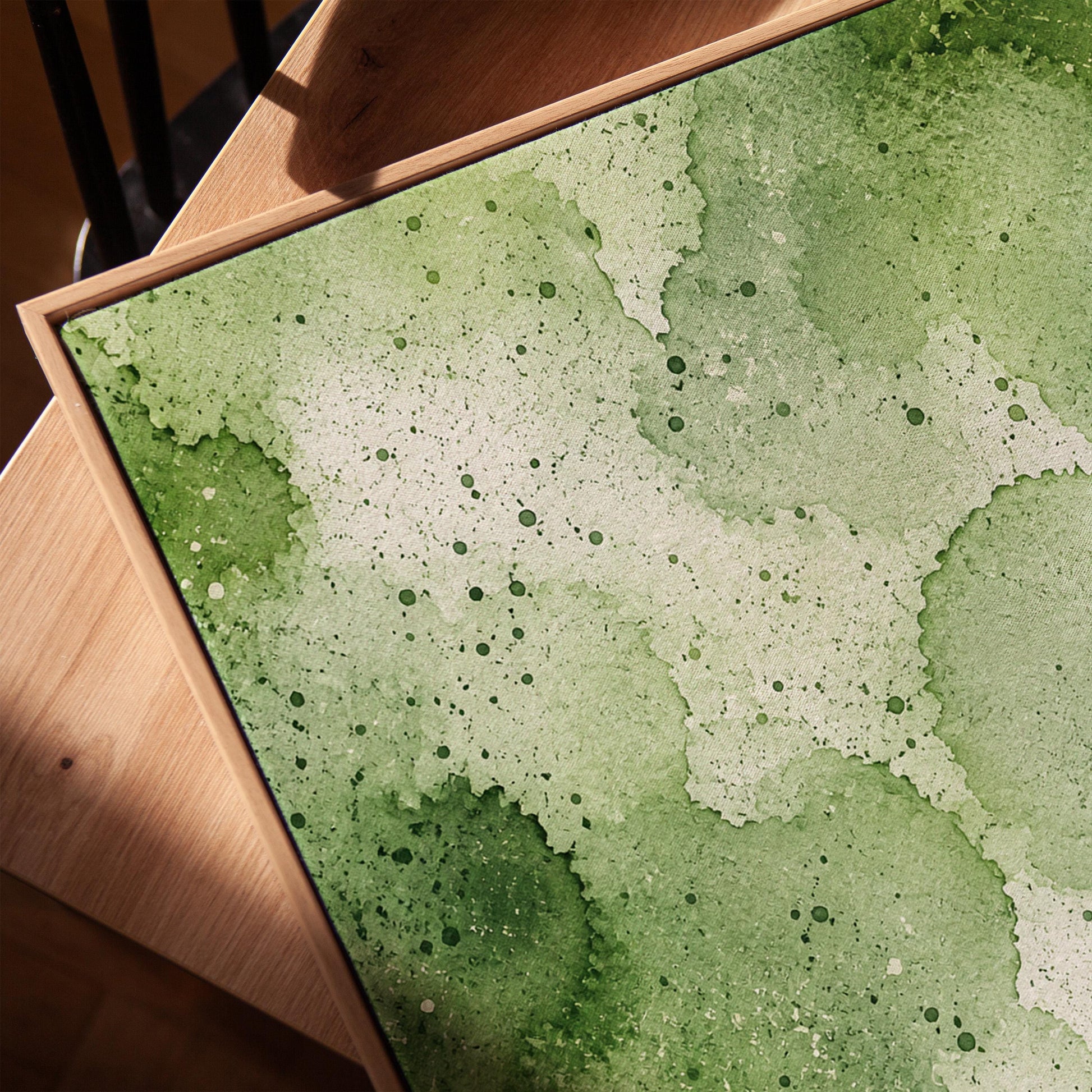 Pale speckled green watercolor wash, light and airy, canvas print in a warm, minimally styled interior