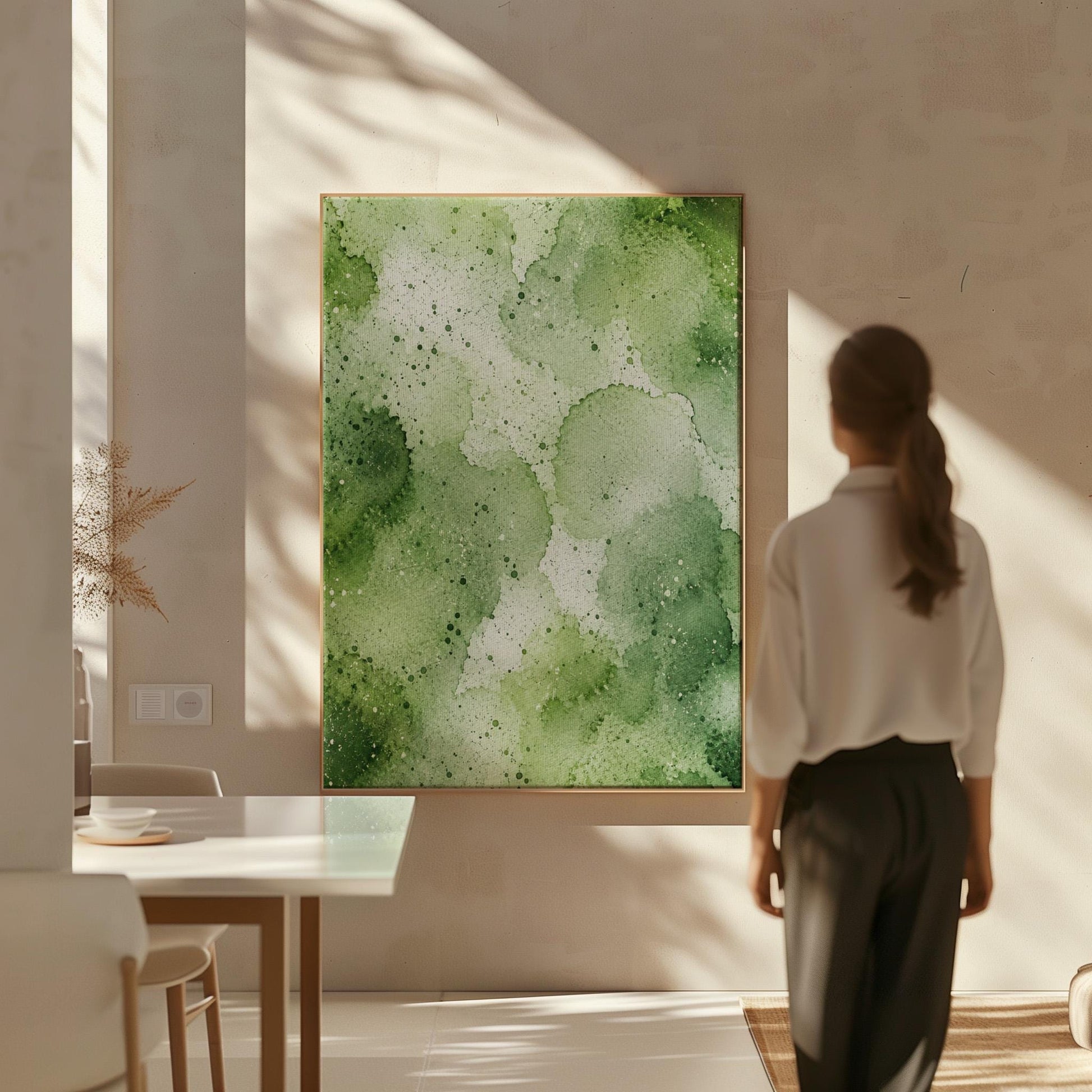 Pale speckled green watercolor wash, light and airy, canvas print seen in a warm interior with natural light