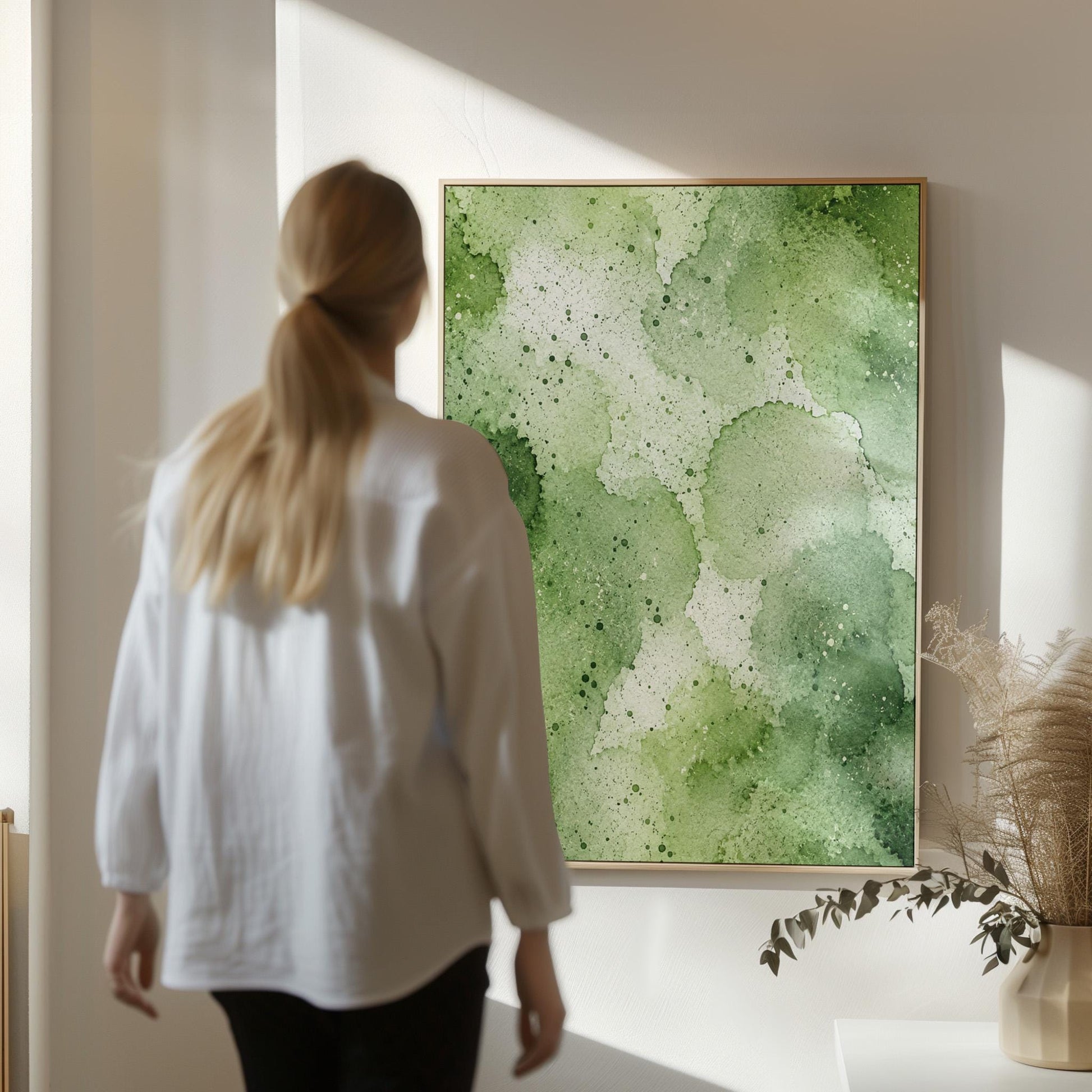 Pale speckled green watercolor wash, light and airy, canvas wall art styled against a soft white wall