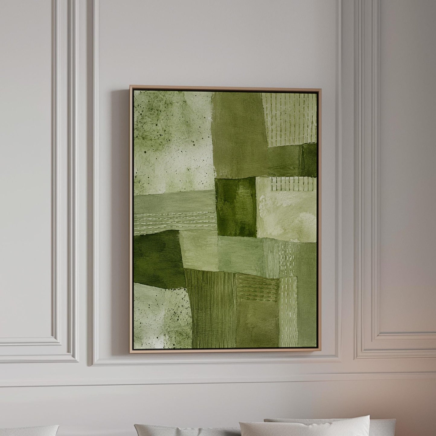 Patchwork of olive and moss green field blocks, canvas print in a bright room with natural daylight