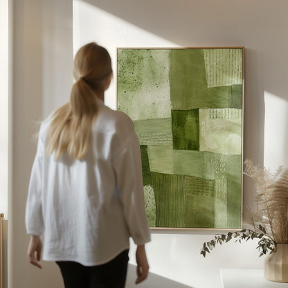 Patchwork of olive and moss green field blocks, canvas print styled against a soft white wall