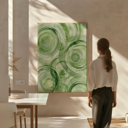 Concentric ripple rings in soft watercolor greens, canvas print styled against a soft white wall