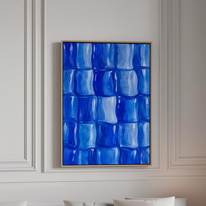 Grid of rounded squares in layered cobalt blues, canvas print in a bright room with natural daylight
