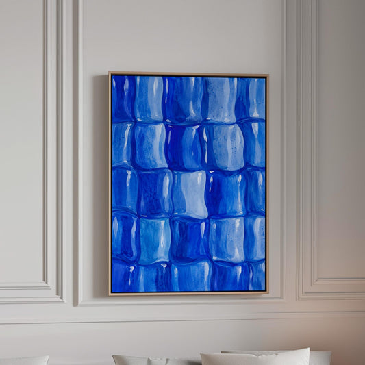 Grid of rounded squares in layered cobalt blues, canvas print in a bright room with natural daylight