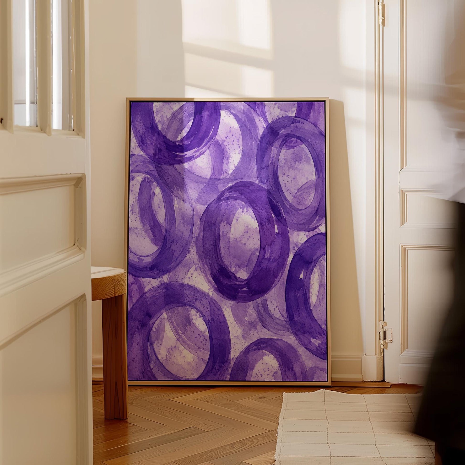 Swirling amethyst purple rings on pale background, canvas print on a quiet wall in a considered interior