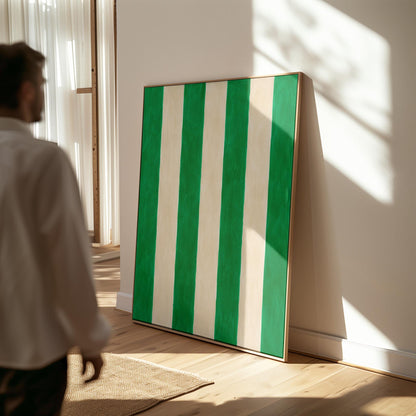 Bold vertical cabana stripes in emerald green and cream, canvas print on a quiet wall in a considered interior