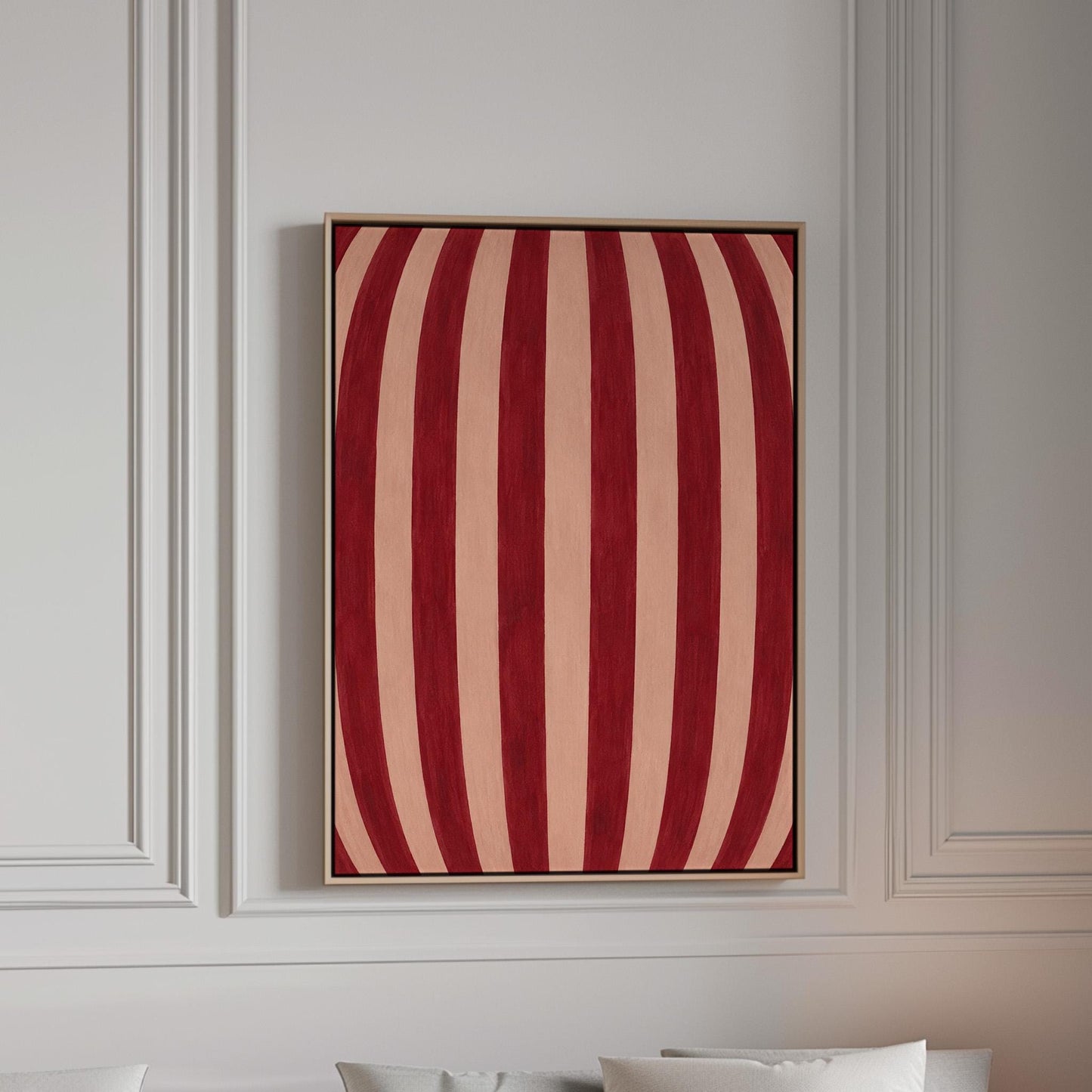 Curved burgundy stripes bowing over blush background, canvas print in a bright room with natural daylight