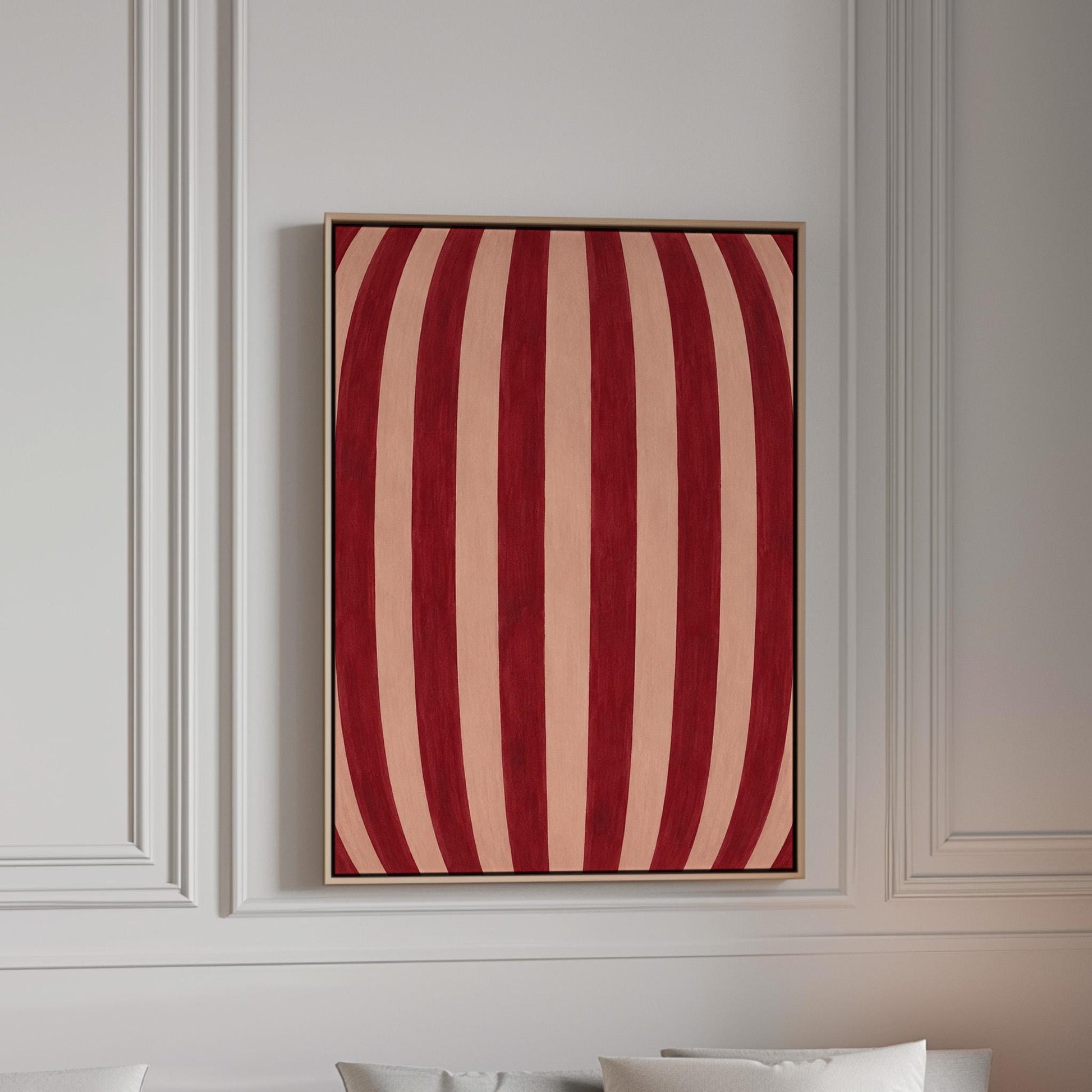 Curved burgundy stripes bowing over blush background, canvas print in a bright room with natural daylight