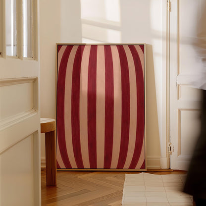 Curved burgundy stripes bowing over blush background, canvas print presented in a light, minimal room