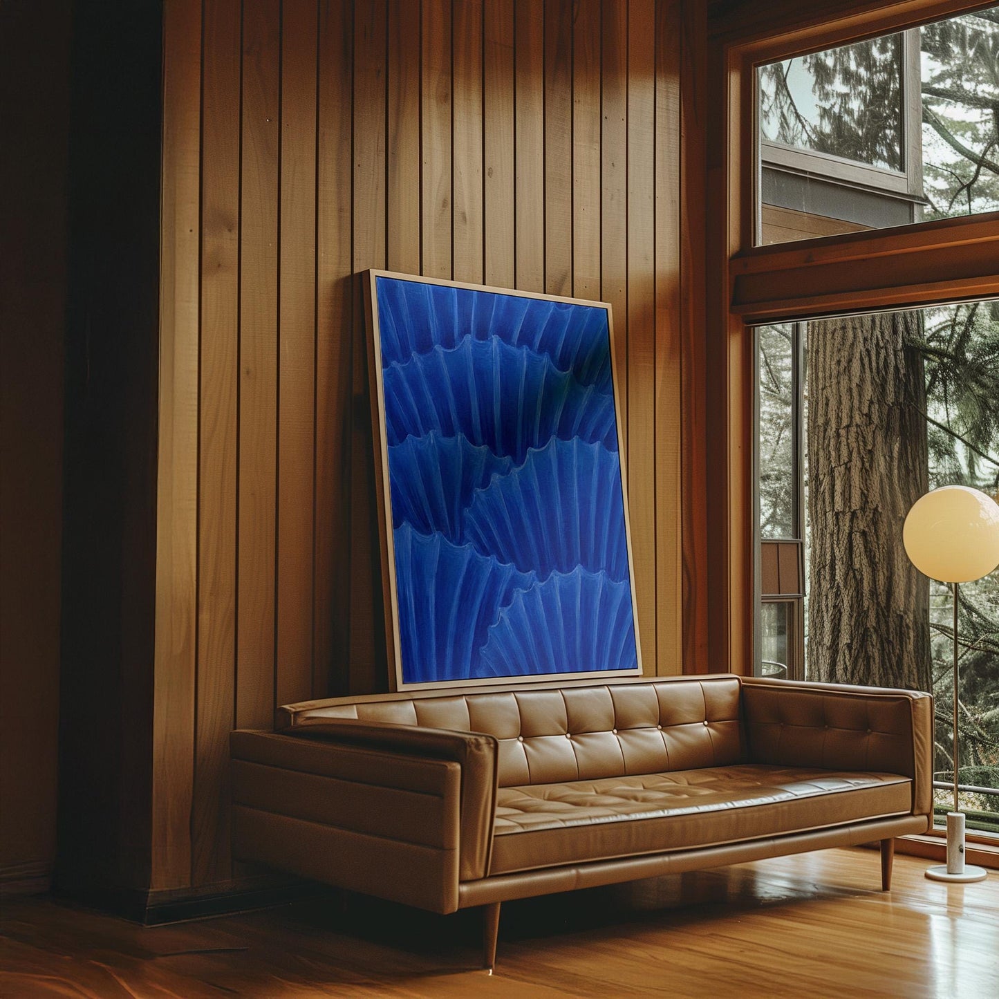 Overlapping pleated fan shapes in deep royal blue, canvas print presented in a light, minimal room