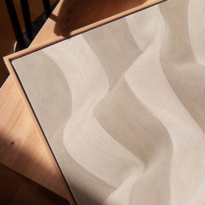 Soft draped wave folds in ivory and warm white, canvas print in a warm, minimally styled interior