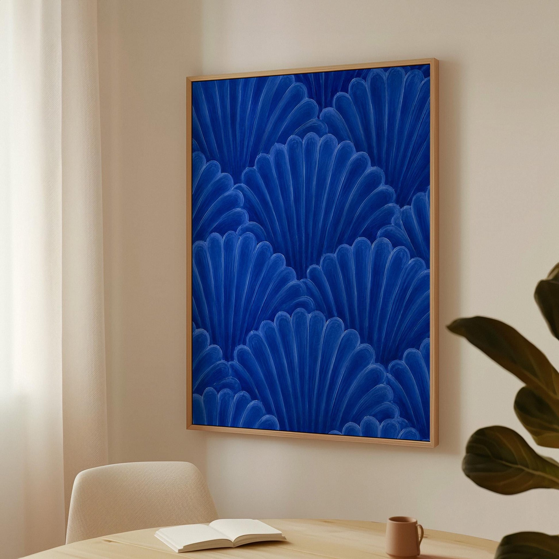 Fan shaped shell scales pattern in sapphire blue, canvas print displayed on a neutral wall in a styled interior