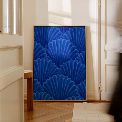Fan shaped shell scales pattern in sapphire blue, canvas wall art hanging in a calm, modern living space
