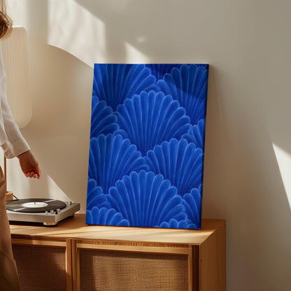 Fan shaped shell scales pattern in sapphire blue, canvas print presented in a light, minimal room