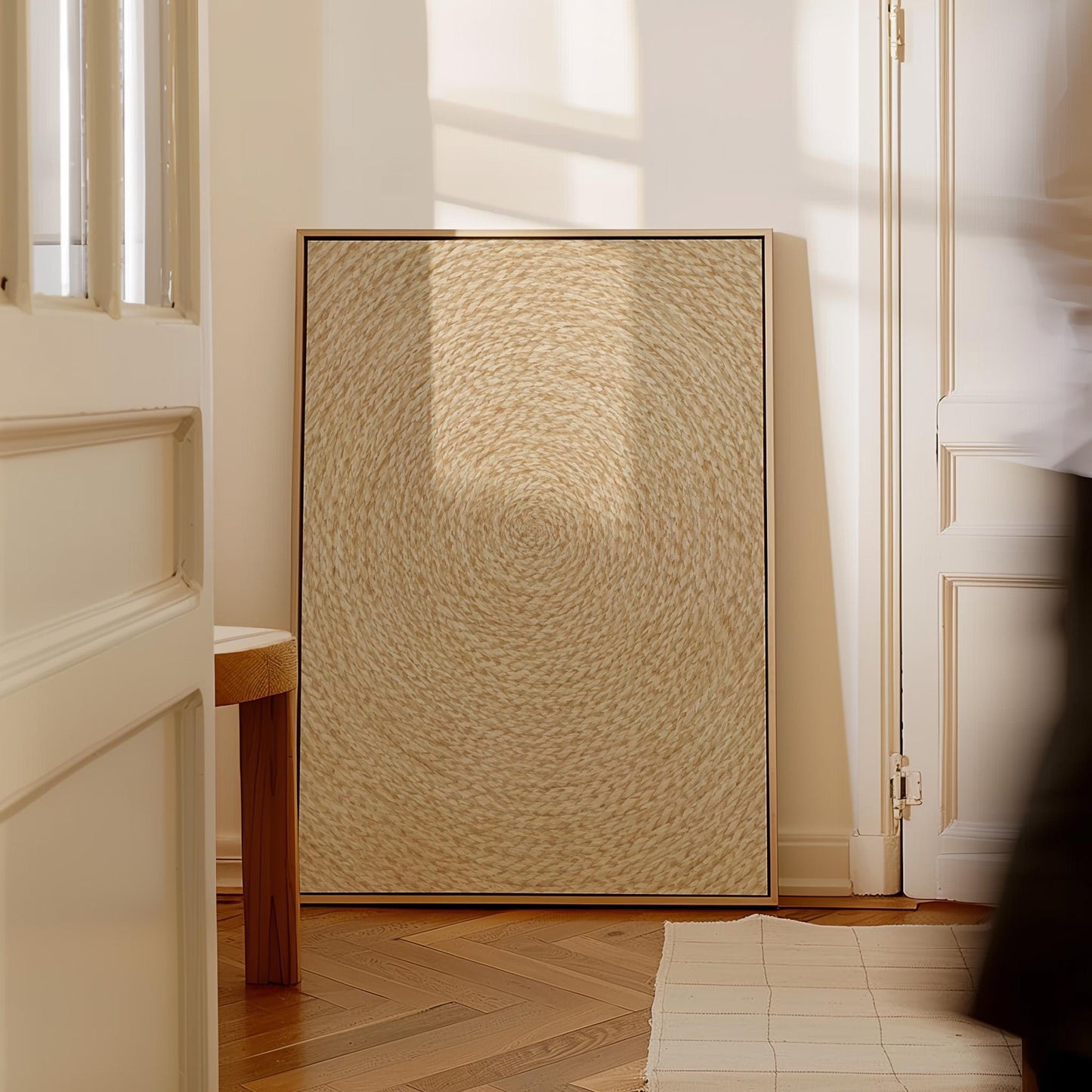 Spiral coiled circle pattern in wheat and straw gold, canvas print presented in a light, minimal room