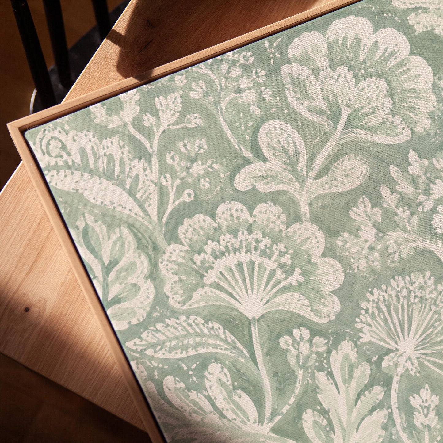 Lace like botanical damask in soft sage green, canvas print in a warm, minimally styled interior