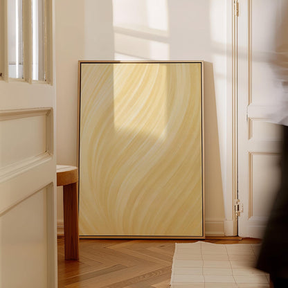 Flowing honey gold waves with soft warm glow, canvas print styled against a soft white wall