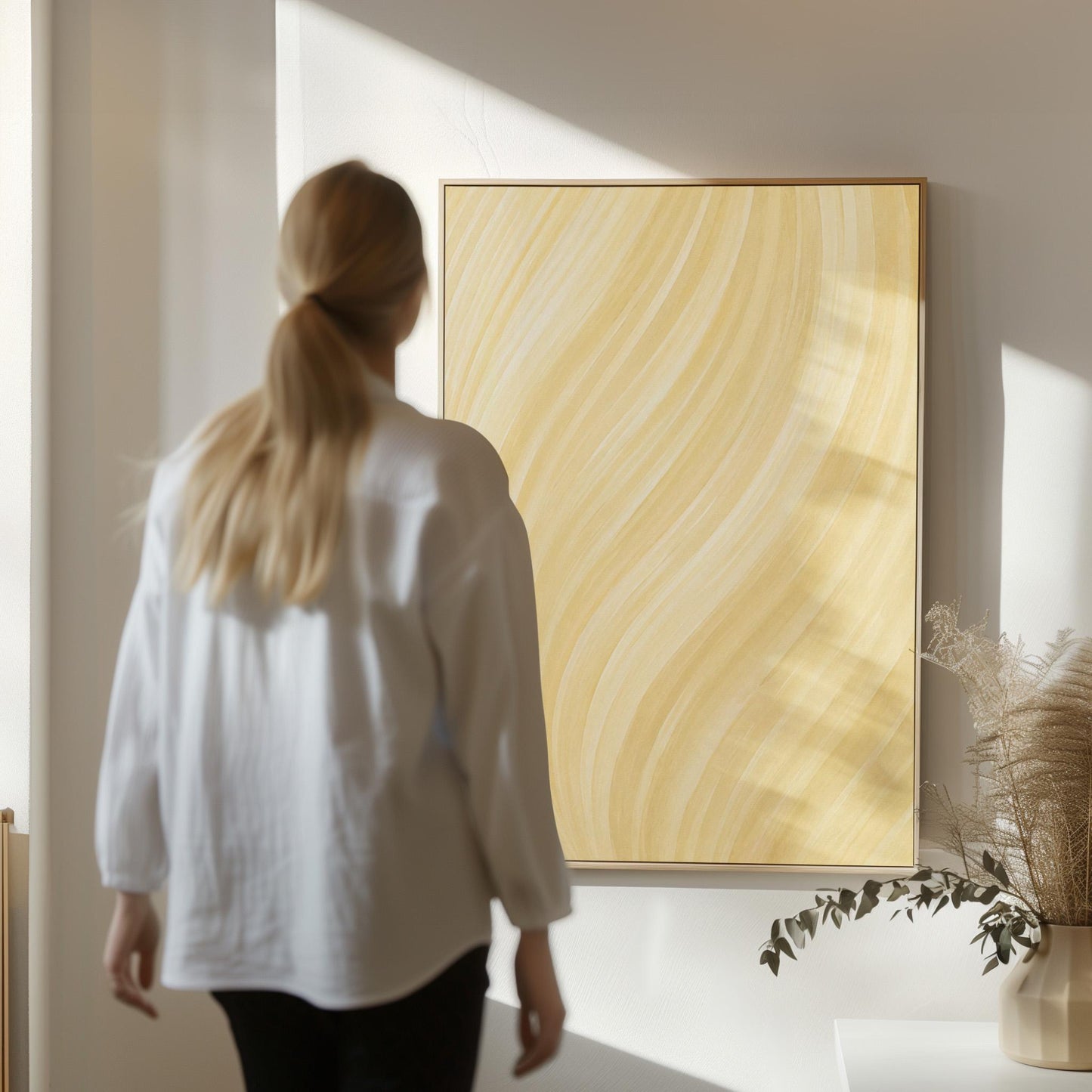 Flowing honey gold waves with soft warm glow, canvas print shown to scale in a furnished room