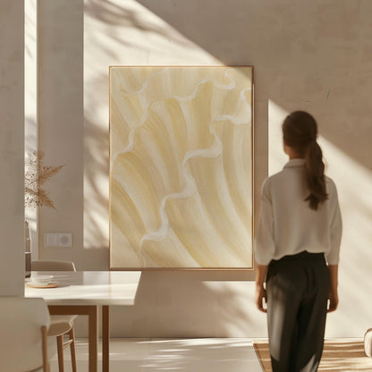 Ruffled wave folds in champagne cream and gold, canvas wall art seen in a warm interior with natural light