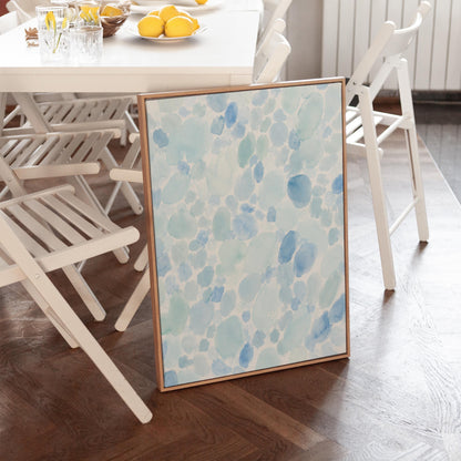 Dappled watercolor petals in light baby blue, canvas print presented in a light, minimal room