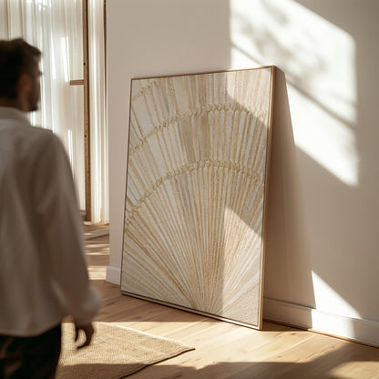 Golden fan palm leaf with radiating rays on cream, canvas wall art styled against a soft white wall