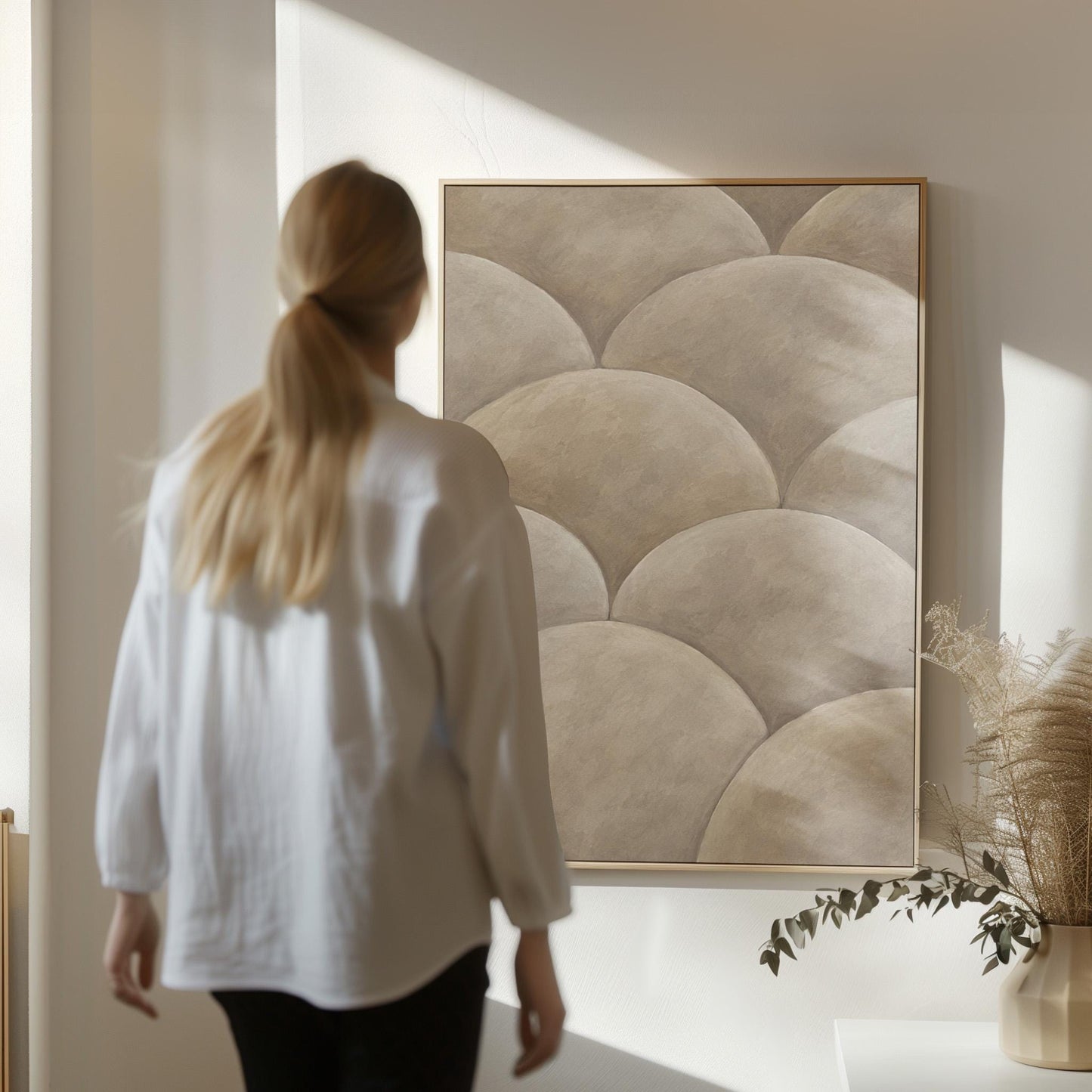 Overlapping dome scallop pattern in warm greige, canvas wall art presented in a light, minimal room