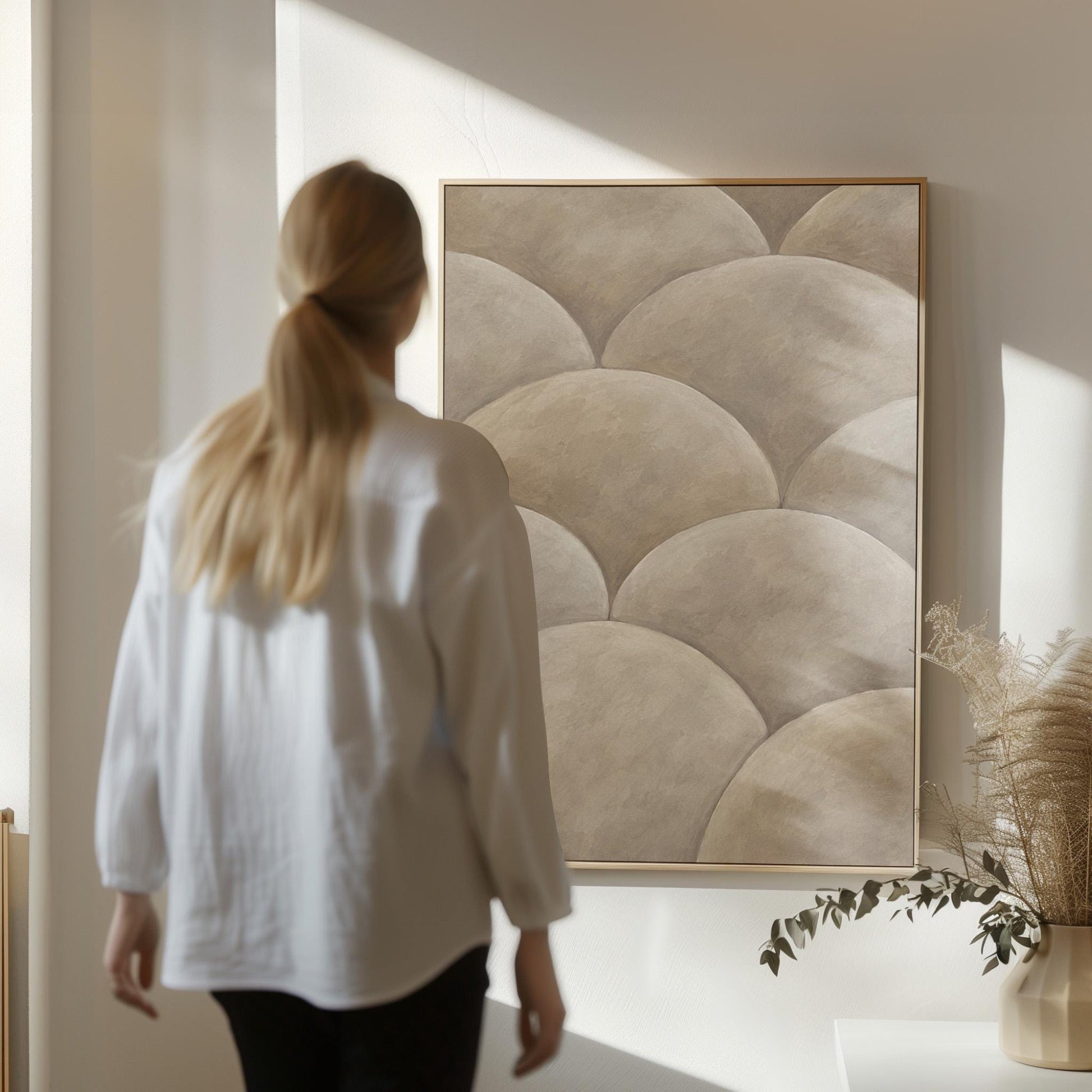 Overlapping dome scallop pattern in warm greige, canvas wall art presented in a light, minimal room