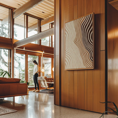 Wavy line pattern fading from beige to rust and brown, canvas print displayed on a neutral wall in a styled interior