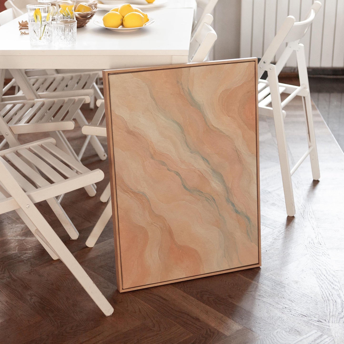 Soft flowing waves in peach blush and gray pastel, canvas print styled against a soft white wall