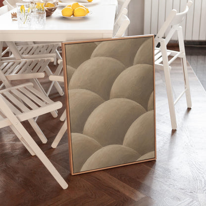 Rows of shaded dome shapes in deep taupe, canvas wall art hanging in a calm, modern living space