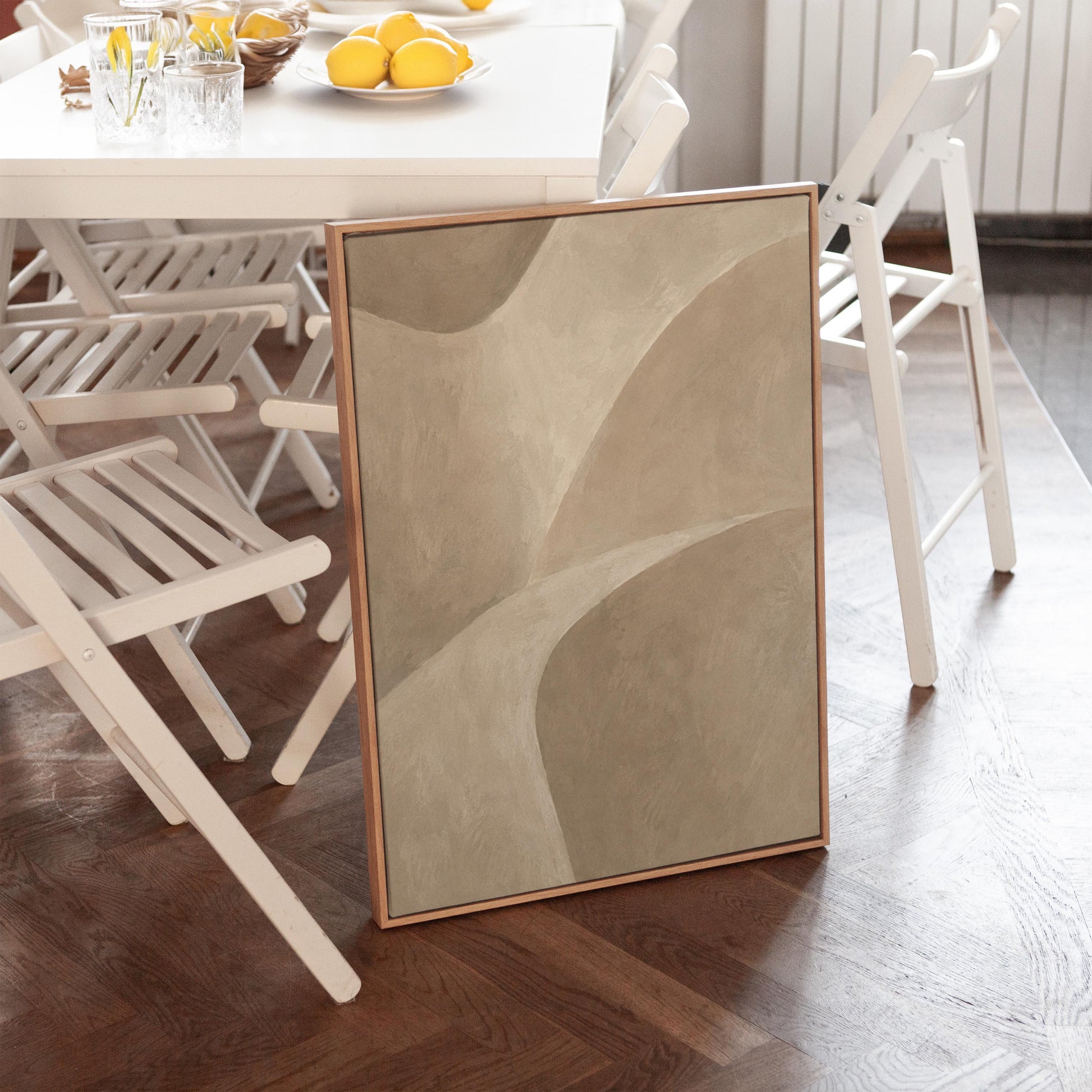 Minimal soft curved lines crossing taupe field, canvas print seen in a warm interior with natural light