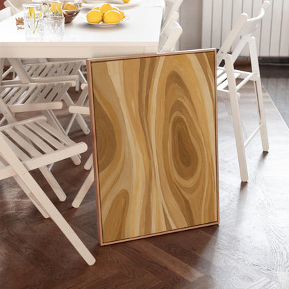 Concentric swirling lines in amber and caramel, canvas print seen in a warm interior with natural light