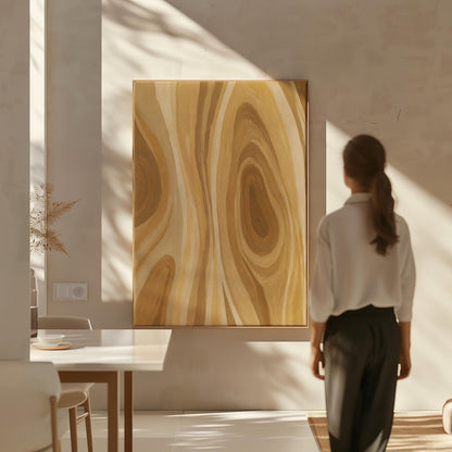 Concentric swirling lines in amber and caramel, canvas wall art hanging in a calm, modern living space