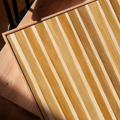 Vertical golden slat stripes in honey tones, canvas print in a warm, minimally styled interior