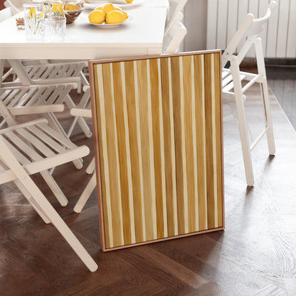 Vertical golden slat stripes in honey tones, canvas print shown in a sunlit, contemporary room
