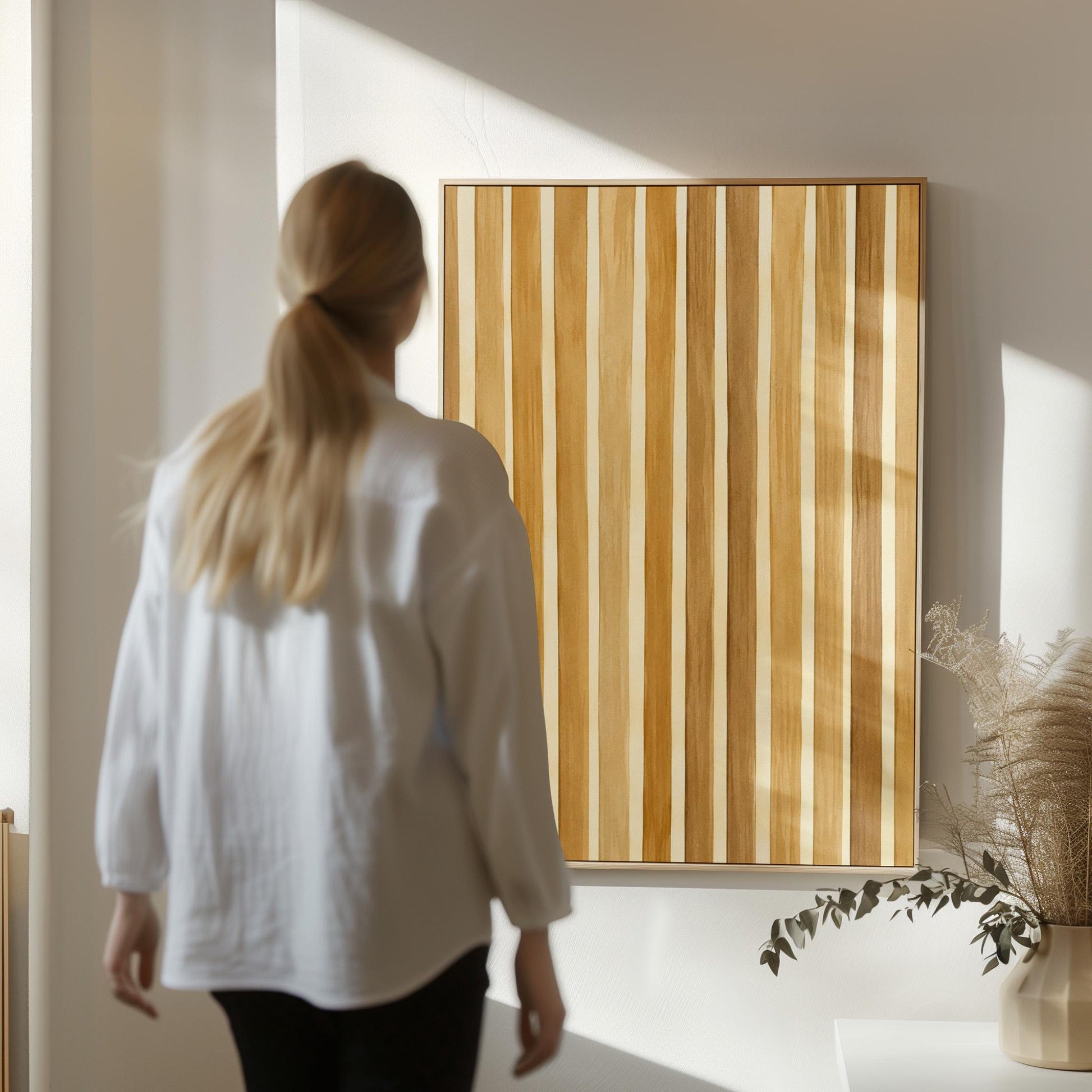 Vertical golden slat stripes in honey tones, canvas wall art styled against a soft white wall
