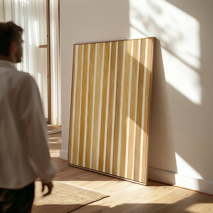 Vertical golden slat stripes in honey tones, canvas print presented in a light, minimal room