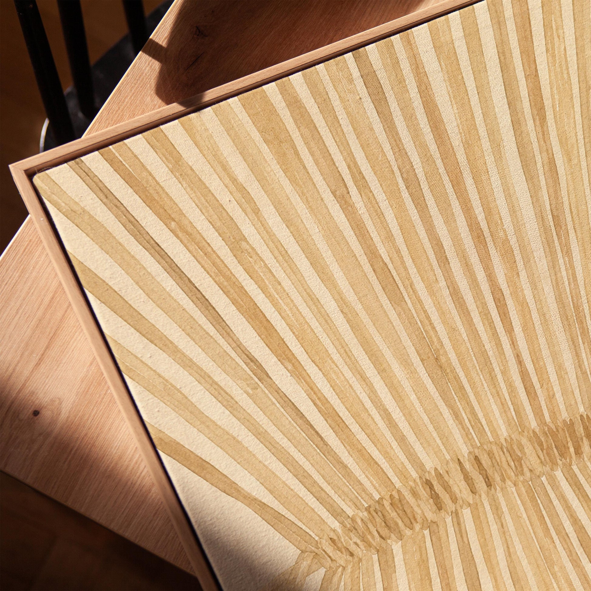 Wheat sheaf with rays fanning from bound center, canvas print in a warm, minimally styled interior