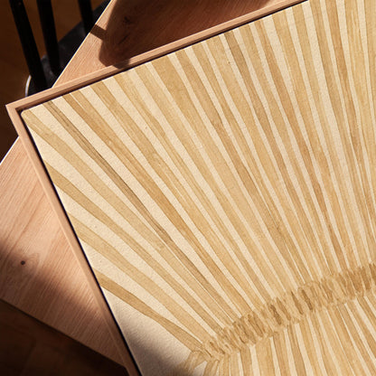 Wheat sheaf with rays fanning from bound center, canvas print in a warm, minimally styled interior