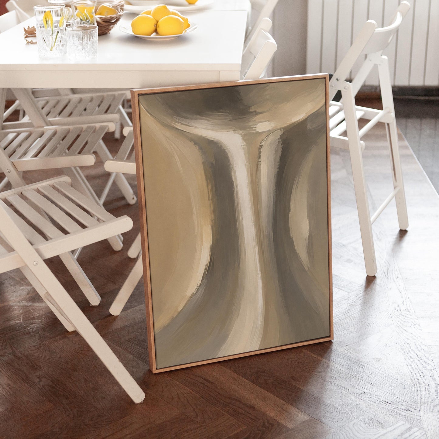 Elegant hourglass curve form in gray and taupe, canvas print shown in a sunlit, contemporary room