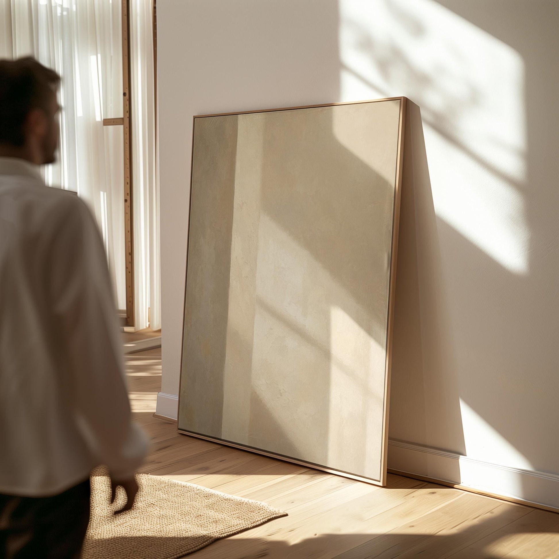 Vertical bands of light and shadow on warm beige, canvas print presented in a light, minimal room